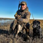 Ramsey Russell and his char dawg enjoying the best argentina duck hunt