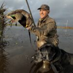 Ramsey Russell and char dawg with speckled teal during argentina duck hunt