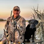 argentina duck hunter Ramsey Russell and retriever